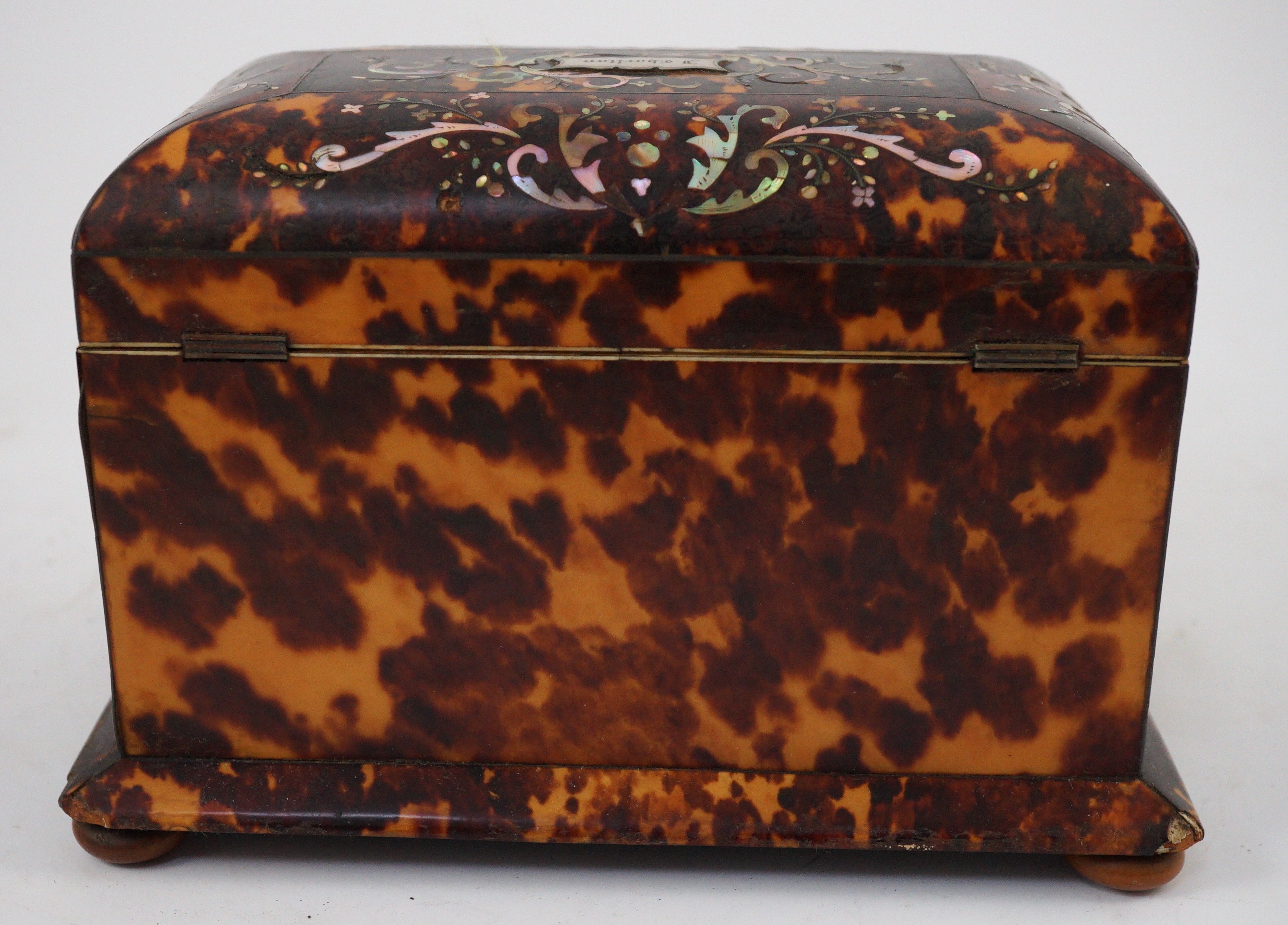 A Regency mother of pearl inset blond tortoiseshell tea caddy, 20cm wide 12.5cm deep 13.5cm high